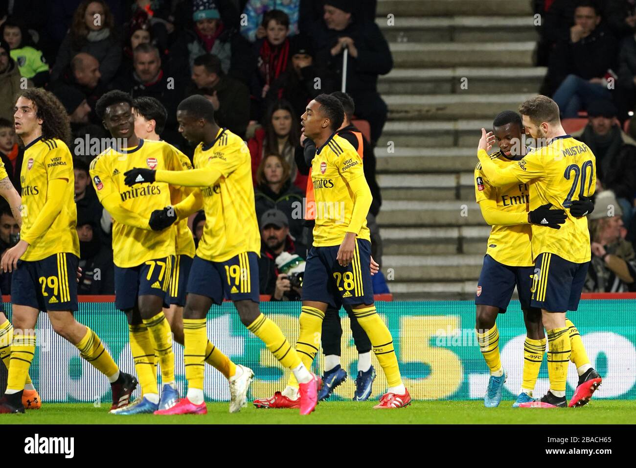 Arsenal's Eddie Nketiah celebrates scoring his sides second goal of the game with teammates Stock Photo