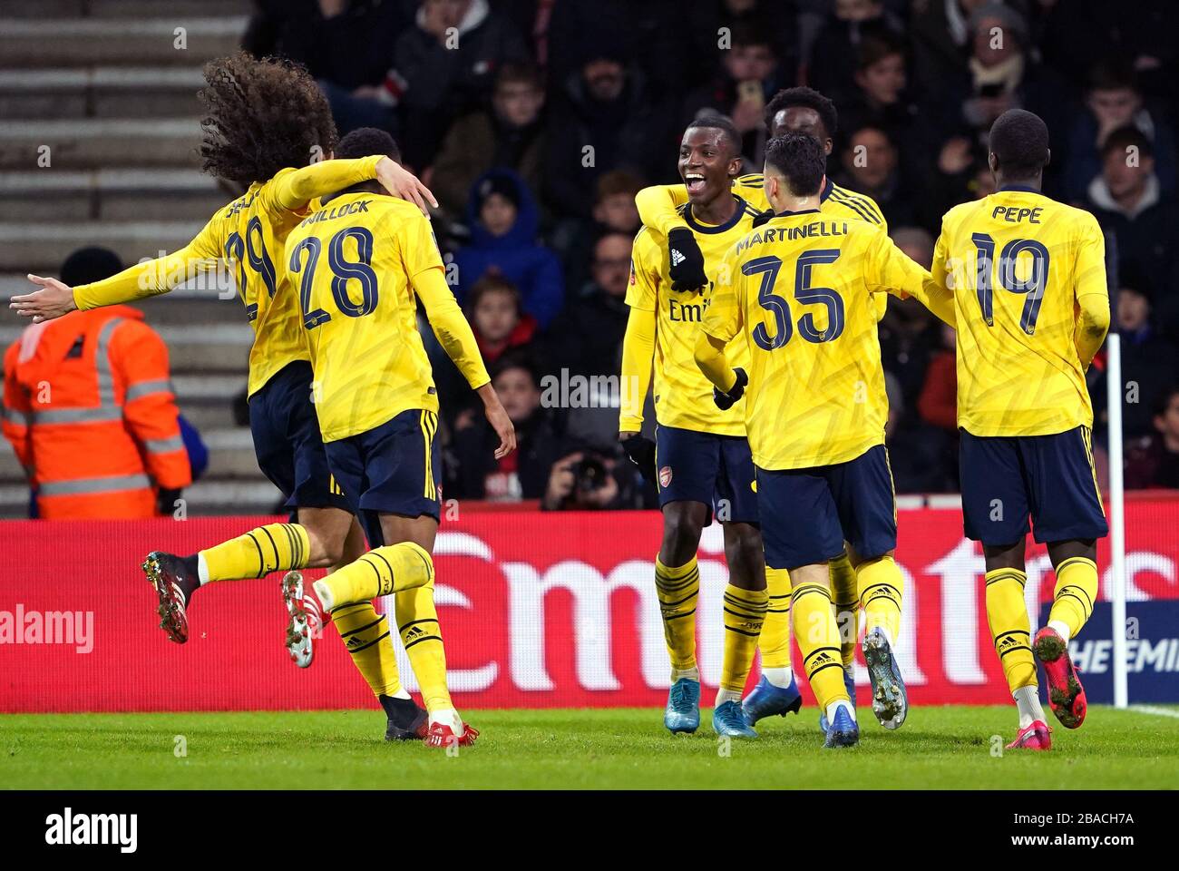 Arsenal's Eddie Nketiah celebrates scoring his sides second goal of the game with teammates Stock Photo