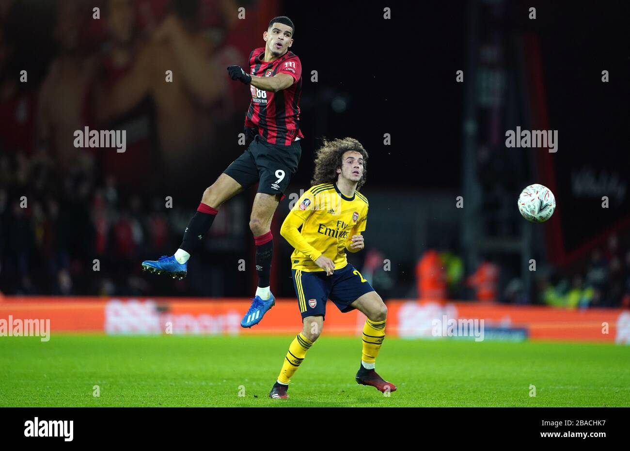 Bournemouth's Dominic Solanke (left) Arsenal's Matteo Guendouzi battle for the ball Stock Photo
