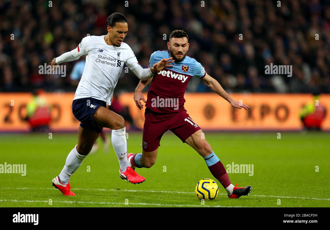 West Ham United's Robert Snodgrass and Liverpool's Virgil van Dijk battle for the ball Stock Photo