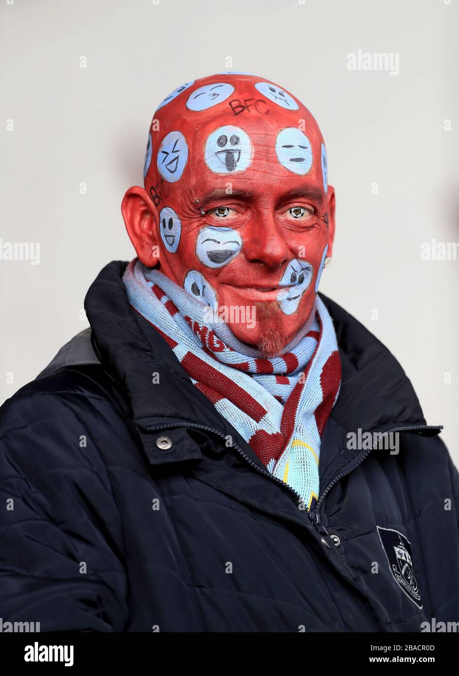 A Burnley fan with emoji facepaint Stock Photo Alamy