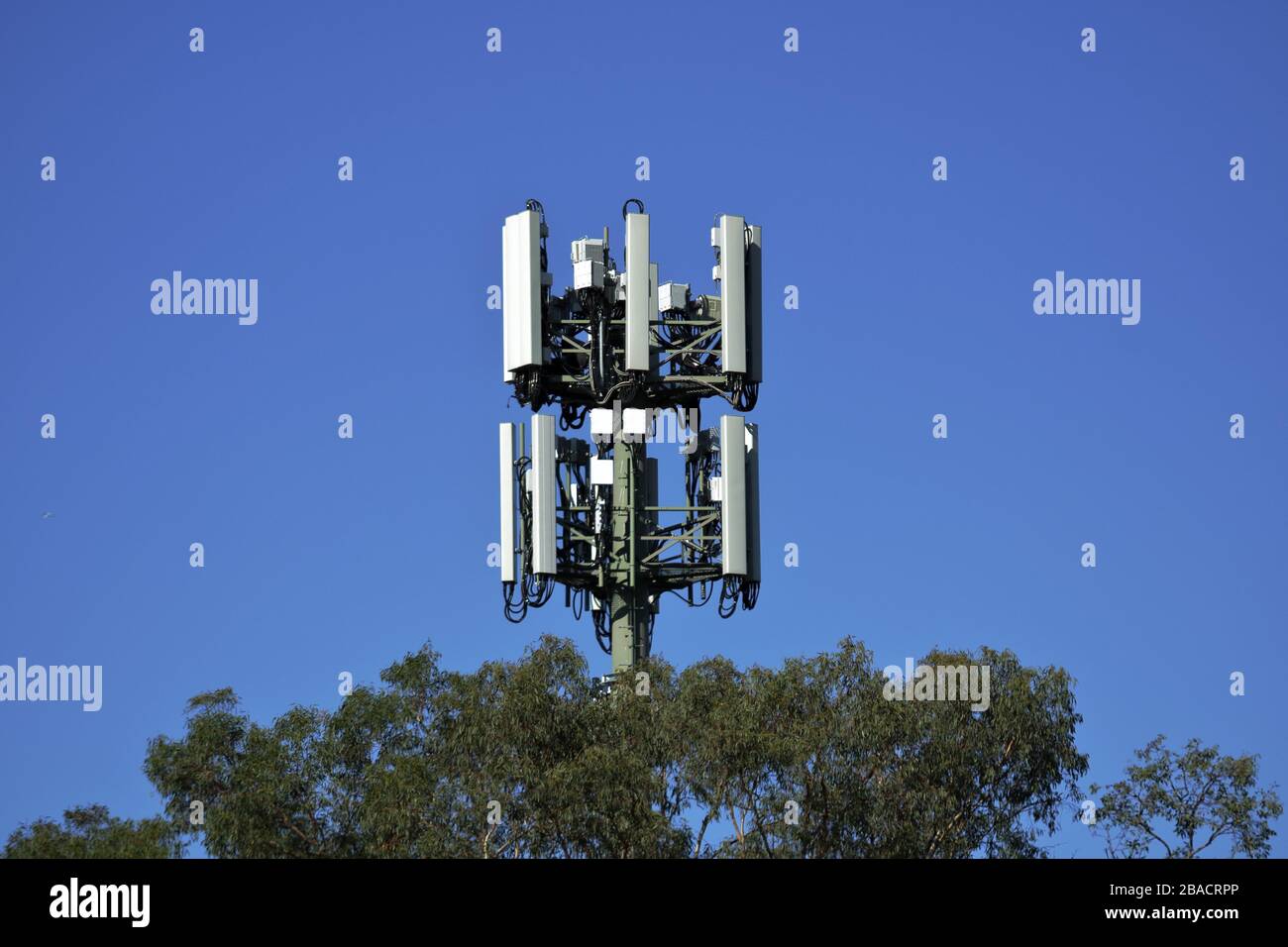 Telecommunications Tower, 5g network in country town. Stock Photo