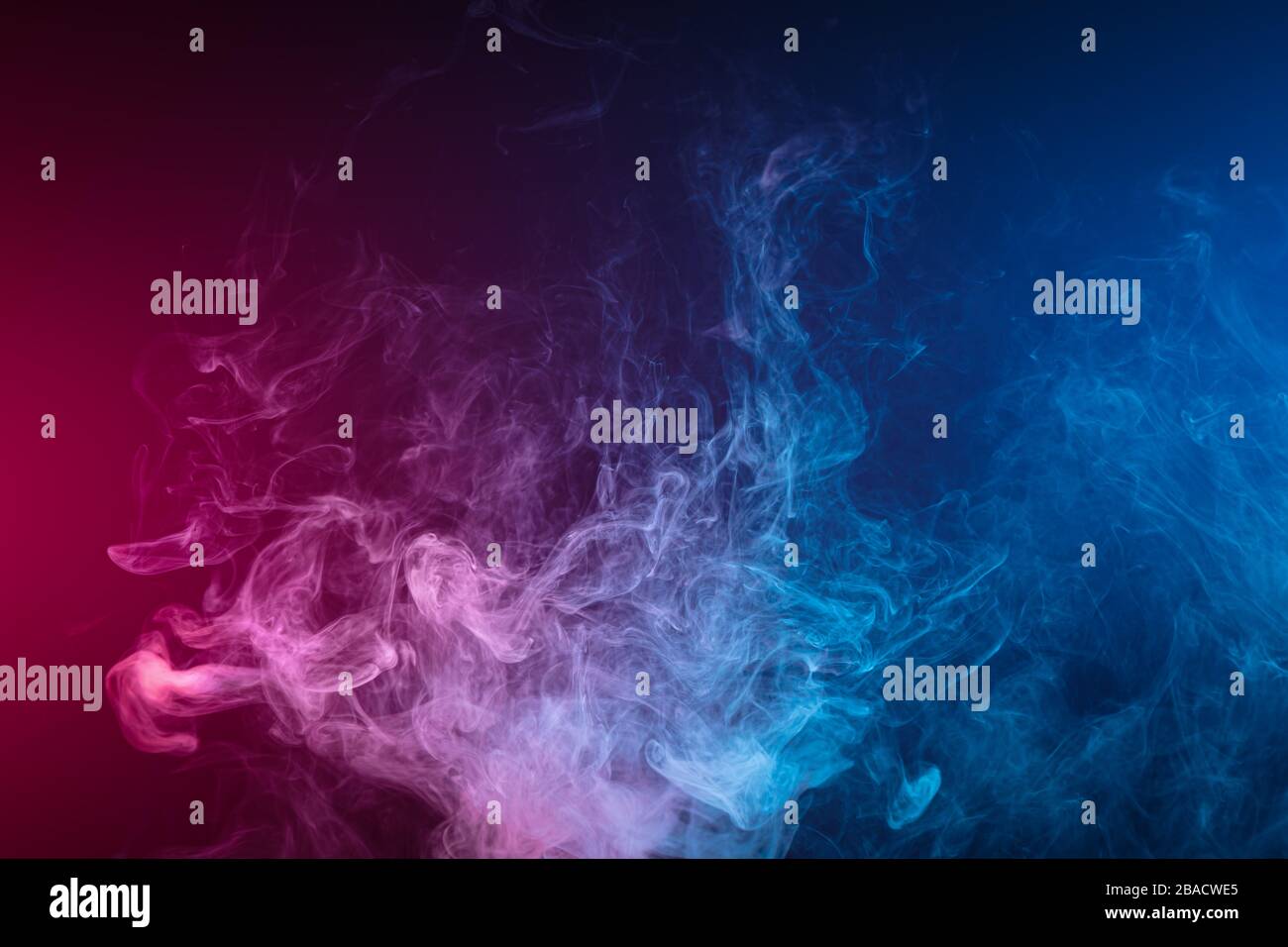 Blue and pink bomb smoke on black isolated background Stock Photo - Alamy