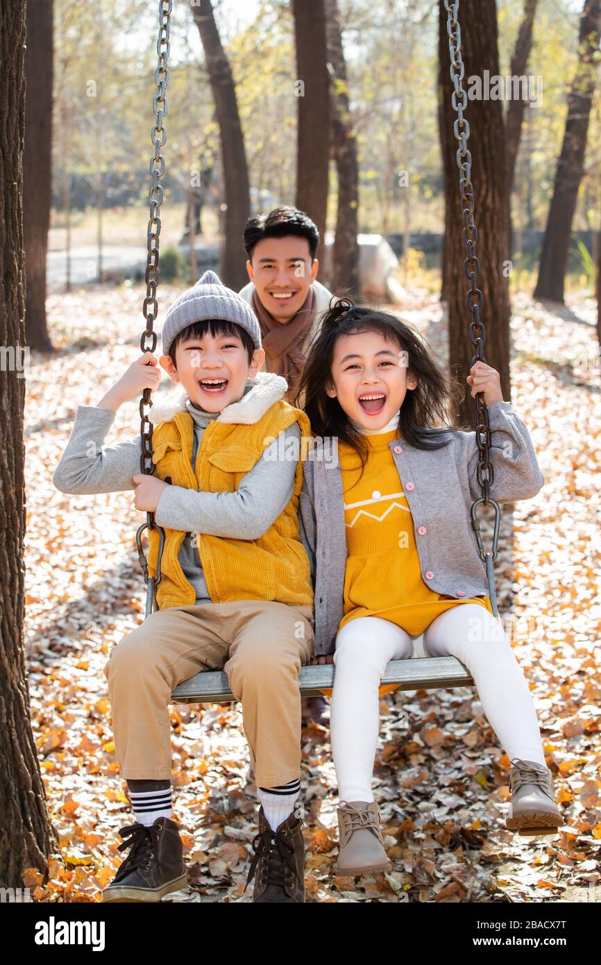 Happy family playing outside Stock Photo