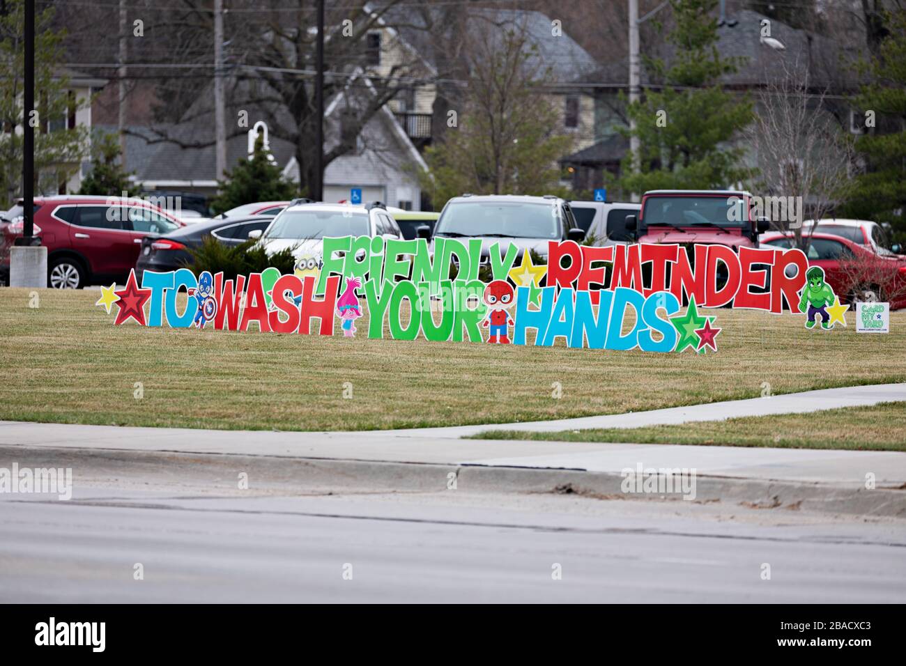 “Friendly Reminder to Wash Your Hands” sign on a hospital lawn in Lincoln, Nebraska. Stock Photo