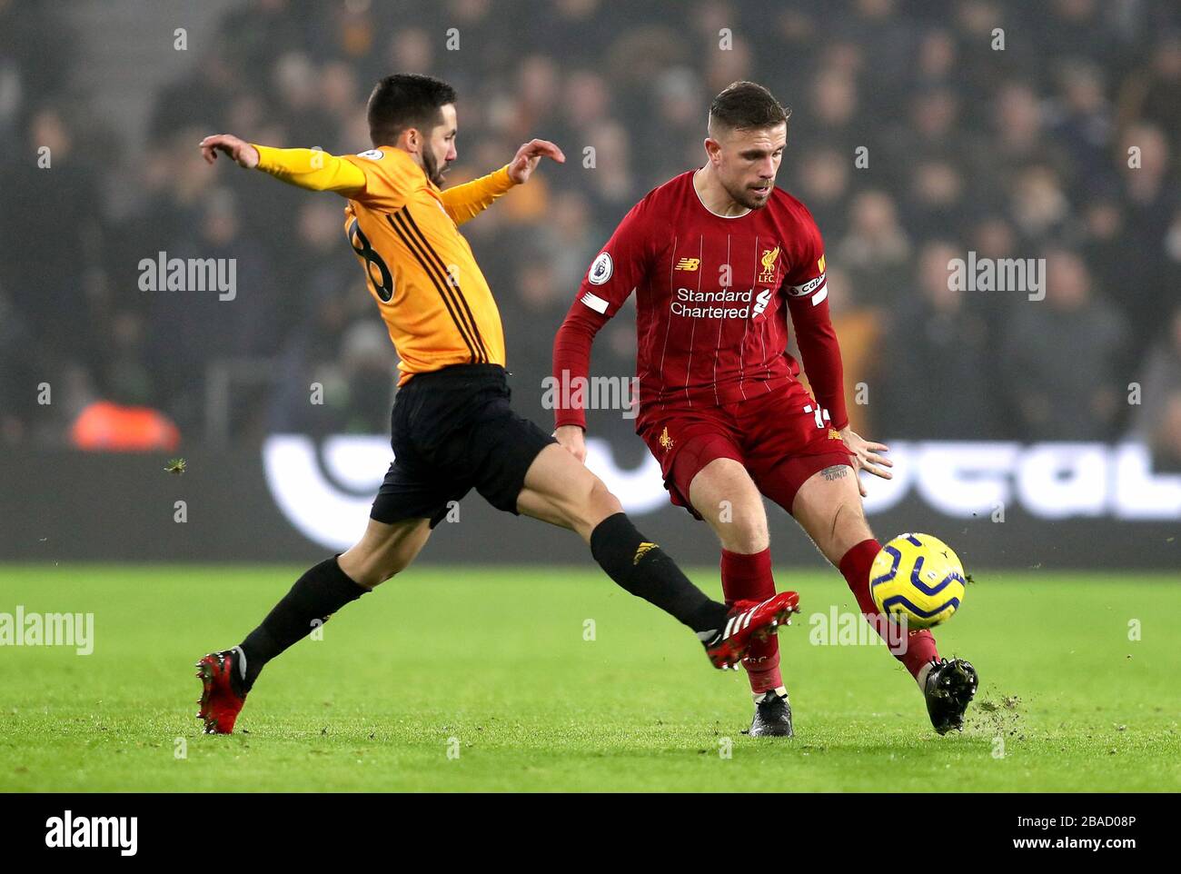 Wolverhampton Wanderers' Joao Moutinho (left) and Liverpool's Jordan Henderson (right) battle for the ball Stock Photo