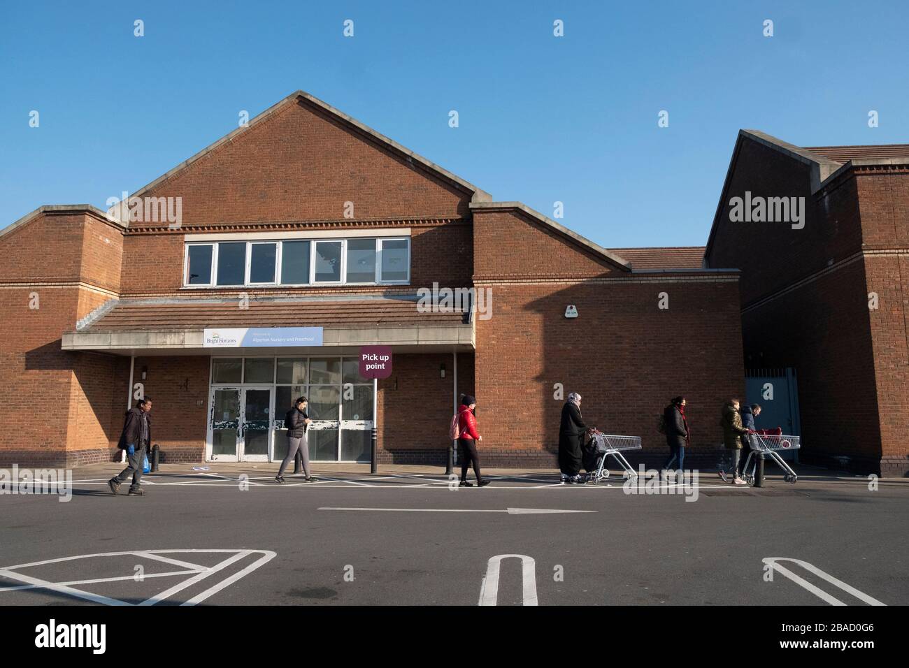 London, UK. 26th Mar, 2020. Customers queue outside a supermarket observing two metres social distancing in London, Britain on March 26, 2020. The British government said on Thursday that the number of confirmed COVID-19 cases in the country has risen to 11,658 as single-day deaths topped 100 for the first time since the outbreak of the disease. Credit: Ray Tang/Xinhua/Alamy Live News Stock Photo