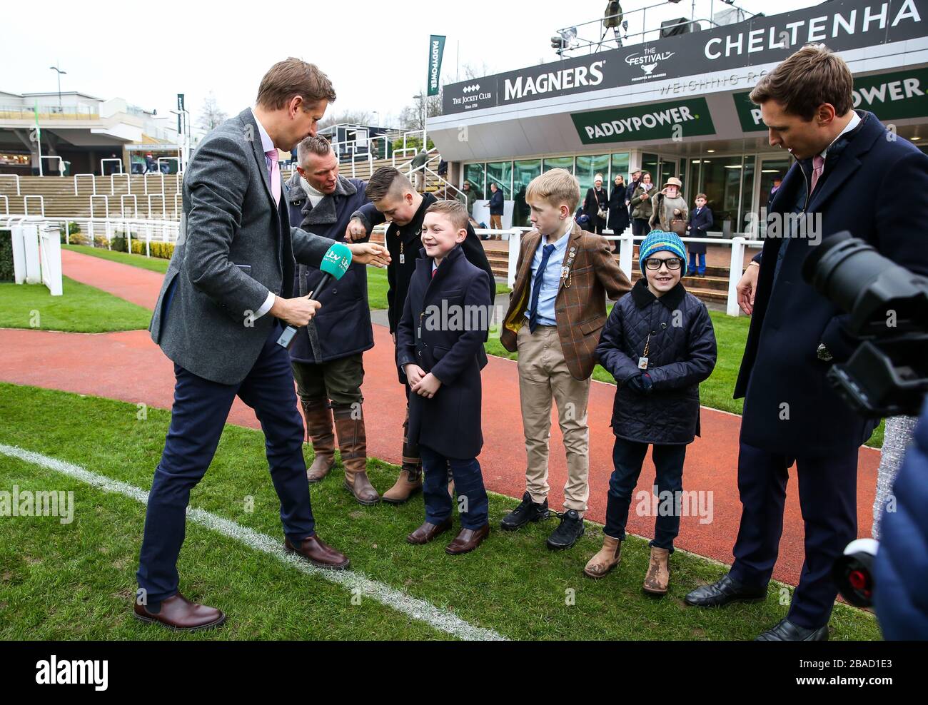 General Images of the Mini me filming for ITV with ITV's Ed Chamberlin during Festival Trials Day at Cheltenham Racecourse. Stock Photo