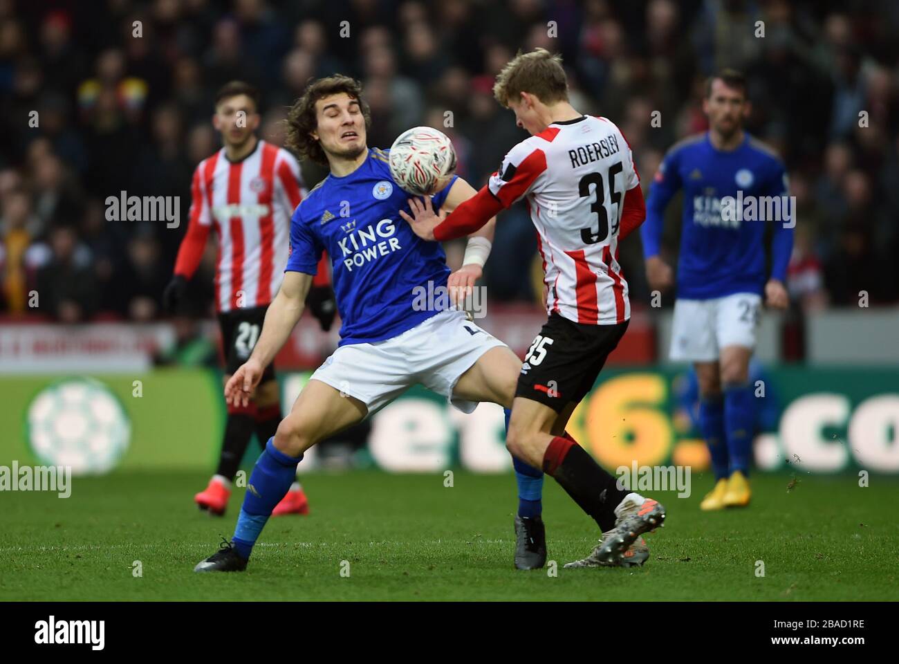 Leicester City's Caglar Soyuncu (left) and Brentford's Mads Roerslev Rasmussen battle for the ball Stock Photo