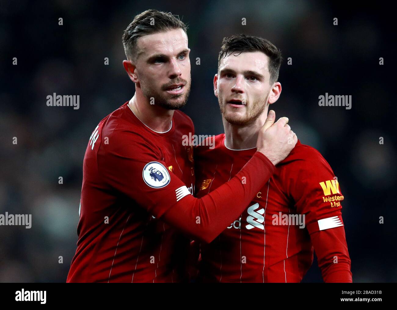 Liverpool's Jordan Henderson (left) and Andrew Robertson celebrate after the final whistle Stock Photo