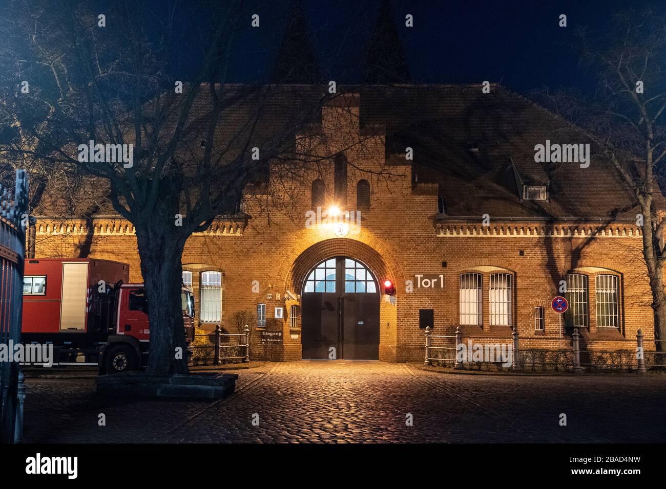 Berlin, Germany. 27th Mar, 2020. The main entrance to the Tegel prison is illuminated. For reasons as yet unknown, a fire broke out in a cell wing there early in the morning. One person was killed. Credit: Paul Zinken/dpa-zb-Zentralbild/dpa/Alamy Live News Stock Photo