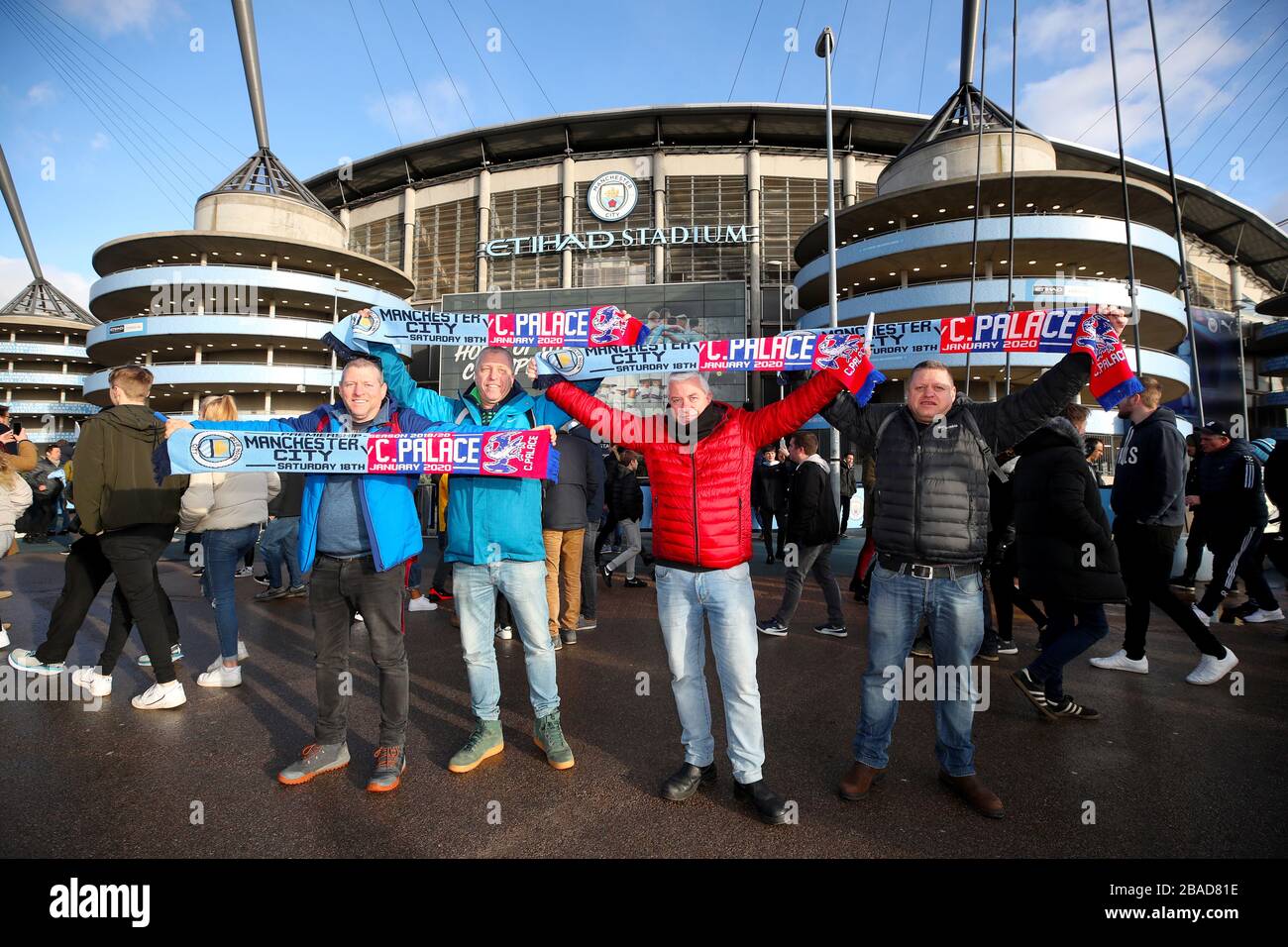 Israeli football fans with half and half scarves show their support ahead of the match Stock Photo