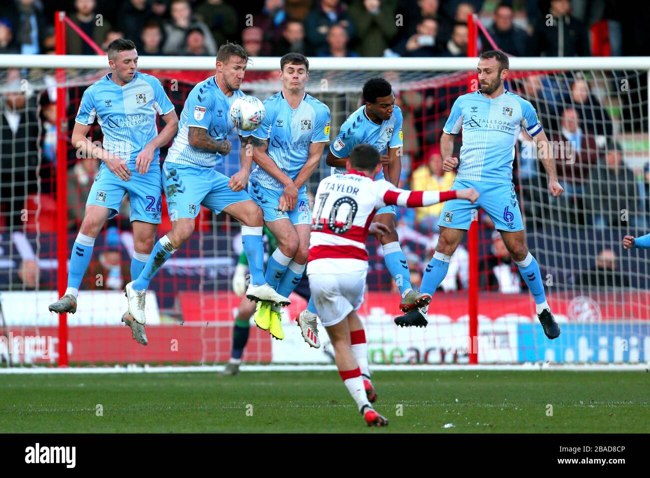 Coventry City players defend a free kick from Doncaster Rovers' Jon Taylor Stock Photo