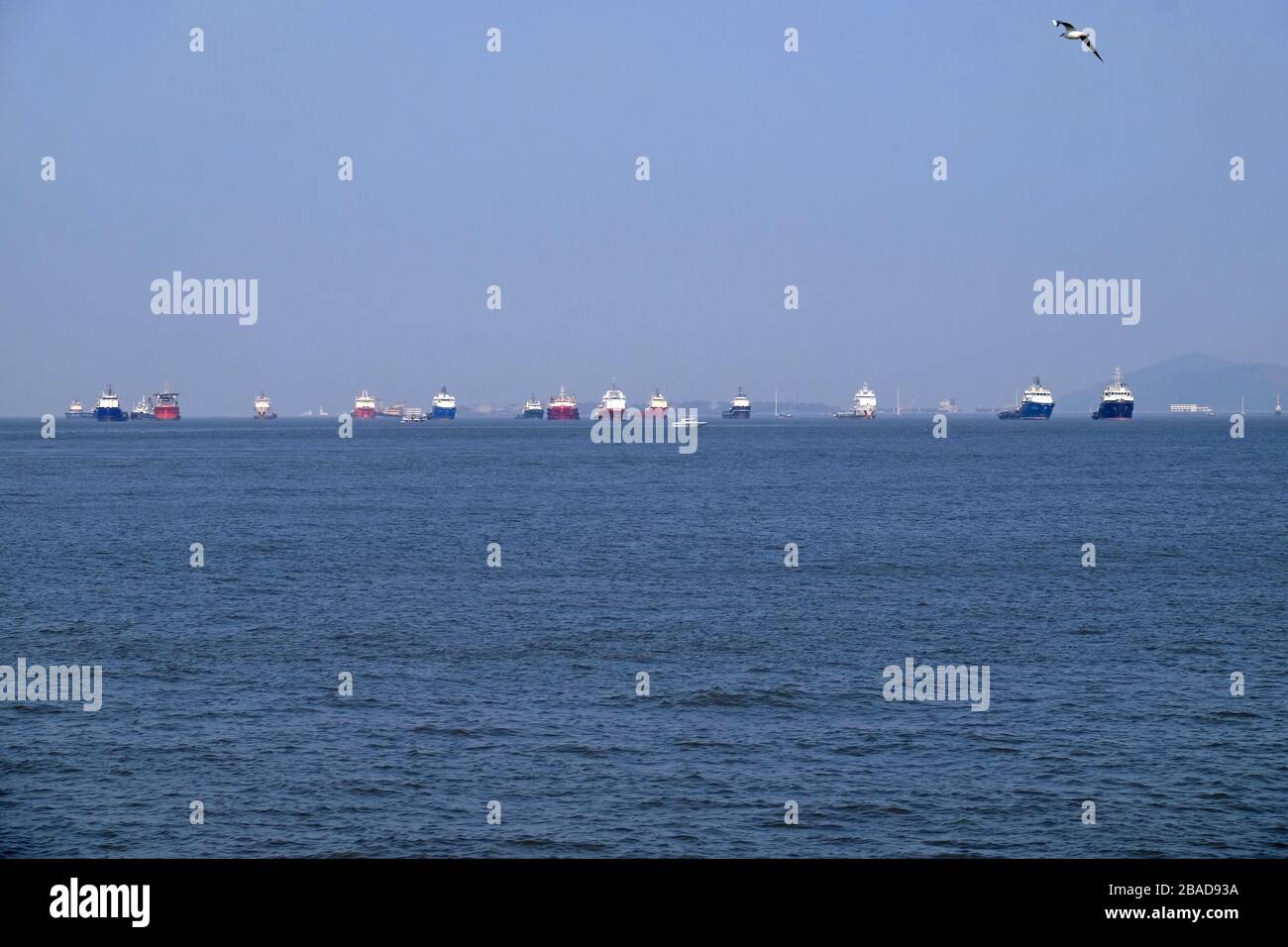 Commercial ship at anchor in the Arabian Sea outside Mumbai, India Stock Photo