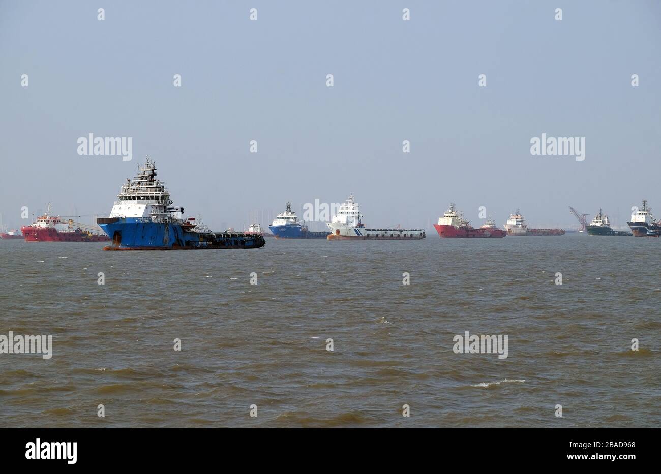 Commercial ship at anchor in the Arabian Sea outside Mumbai, India Stock Photo