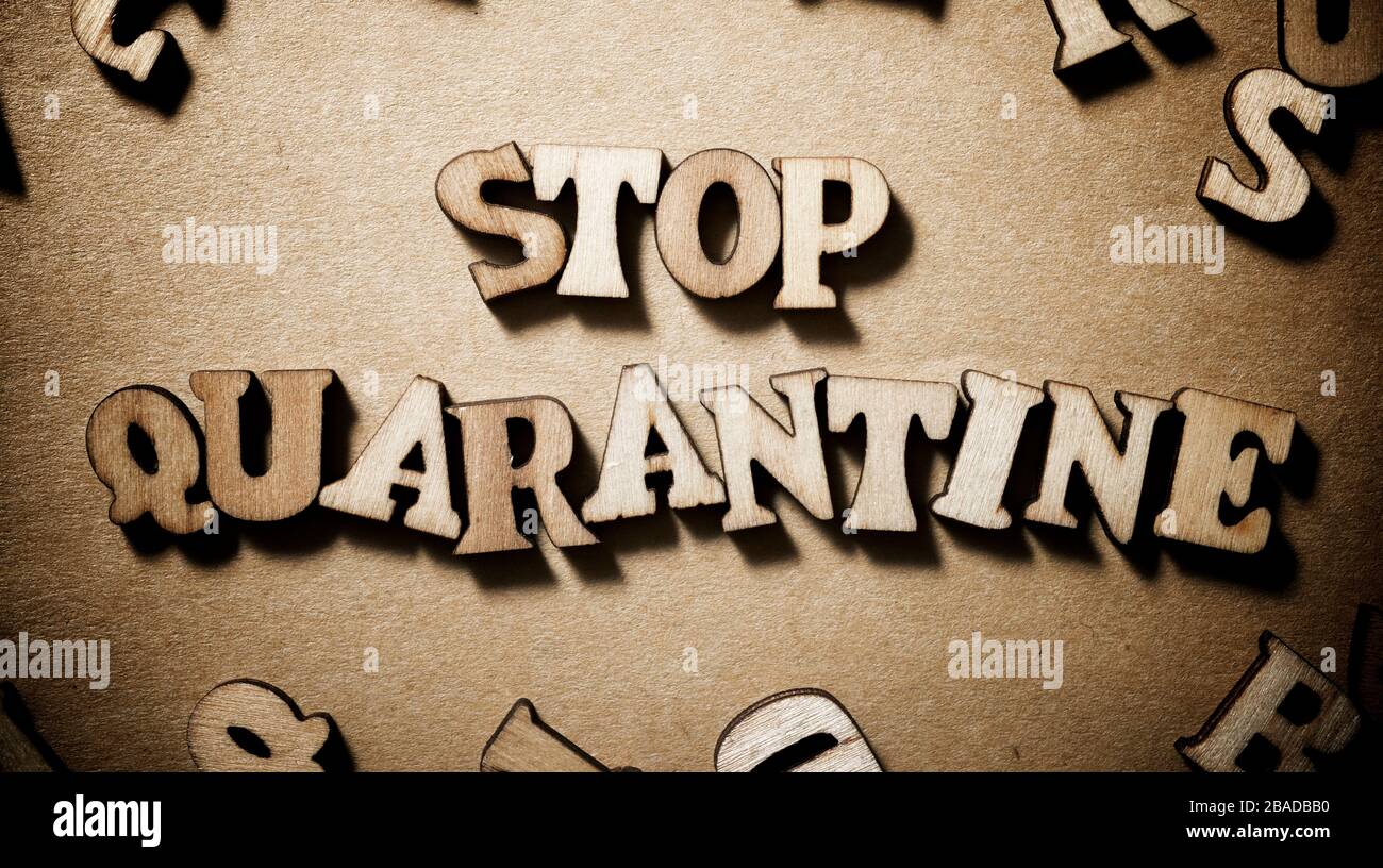 Stop Quarantine sentence on a brown paper Stock Photo Alamy
