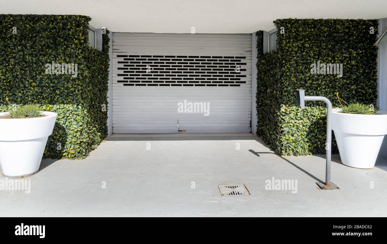 Entrance to underground car vehicle garage with security key pass device to access and egress garage parking.Camps Bay Cape Town. Stock Photo