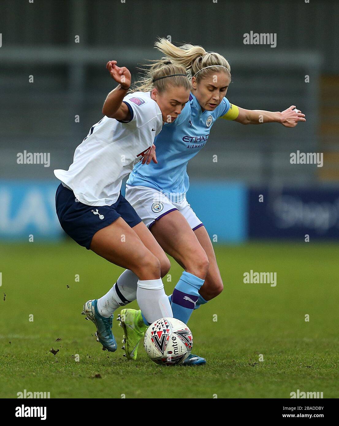 Tottenham Hotspur's Rianna Dean (left) and Manchester City's Steph Houghton battle for the ball Stock Photo