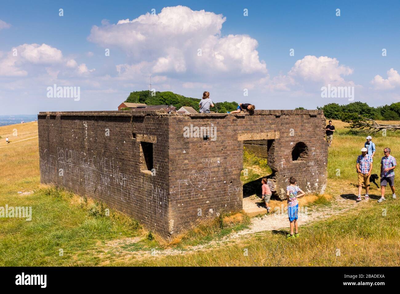 Children Play On An Old Concrete Structure Near Devils Dyke, East Sussex Just Outside Of Brighton, England Stock Photo