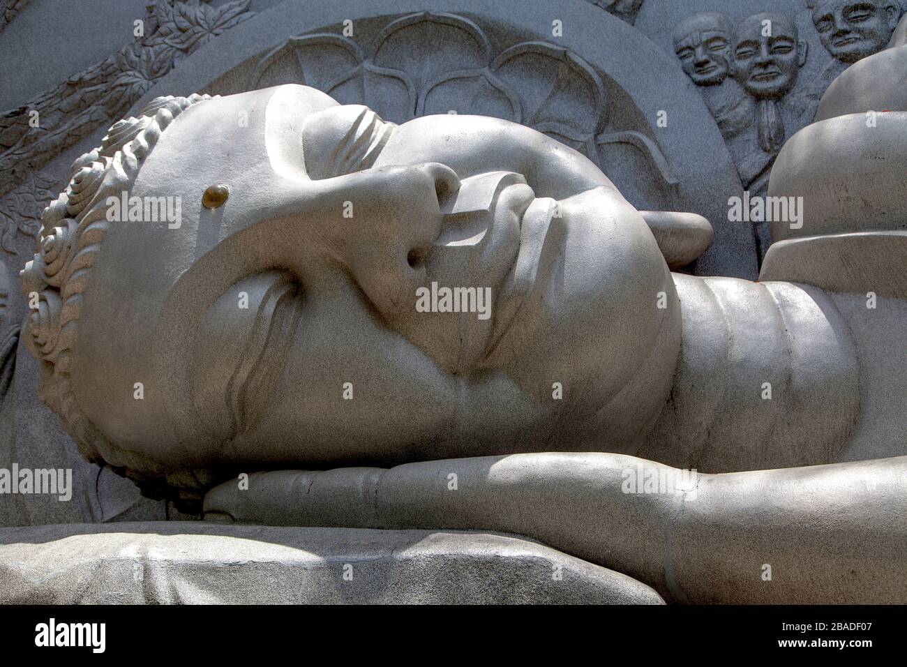 White Buddha Statue at Long Son Pagoda in sunny day at Nha Trang, Vietnam Stock Photo
