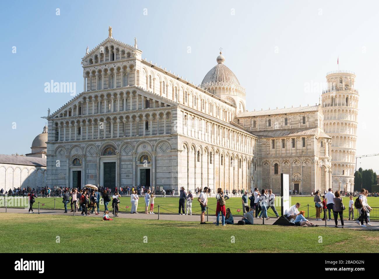 Pisa, Italy-October 21, 2018:tourists walk among the symbolic places of Pisa admiring the beauty and taking pictures during a sunny day Stock Photo