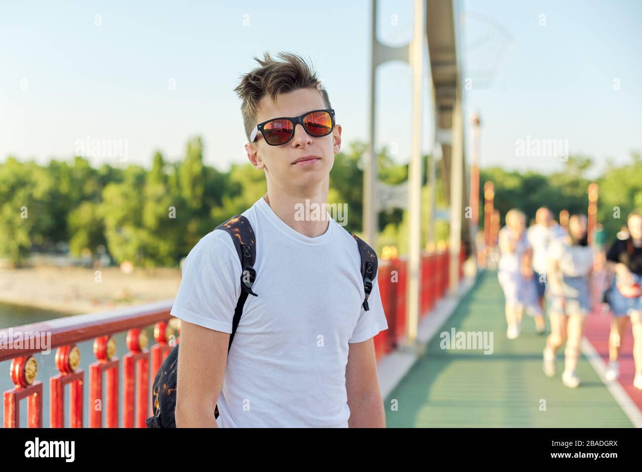 Teen boy 15 years old with fashionable hairstyle sunglasses
