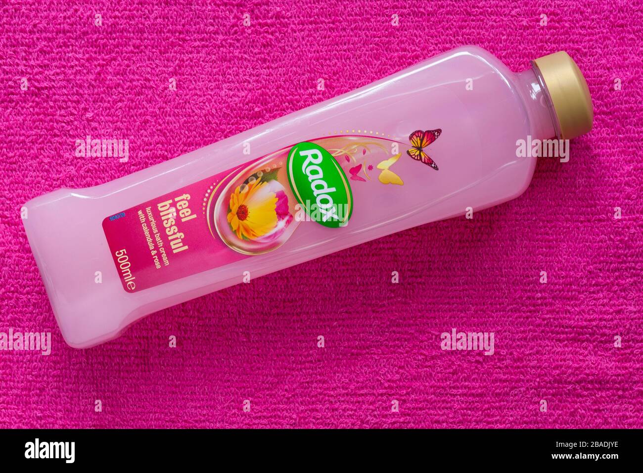 Bottle of Radox feel blissful luxurious bath cream with calendula & rose  on pink towel Stock Photo