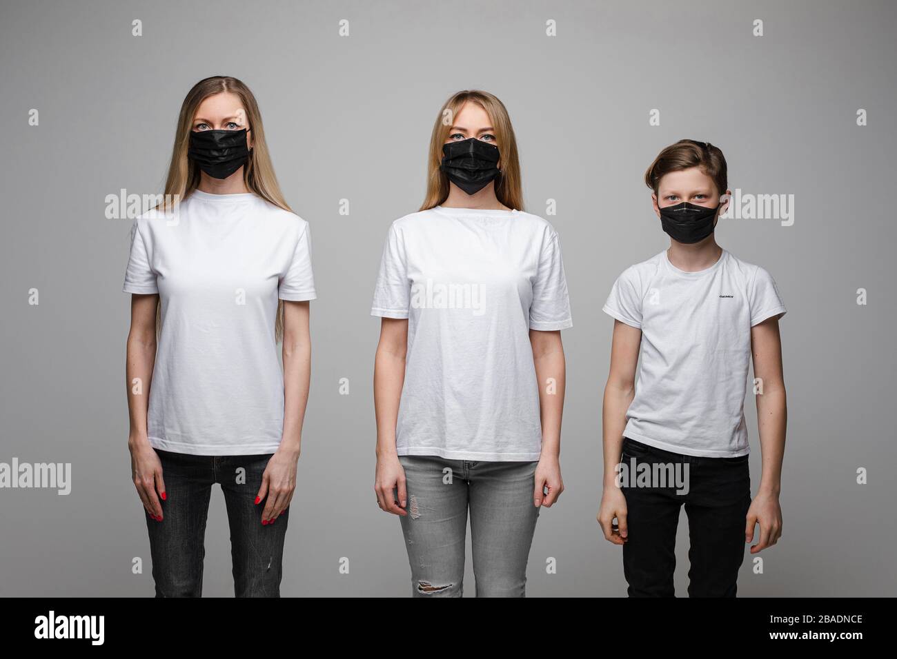 Family in respirators demonstrating anti-virus preventive methods Stock ...