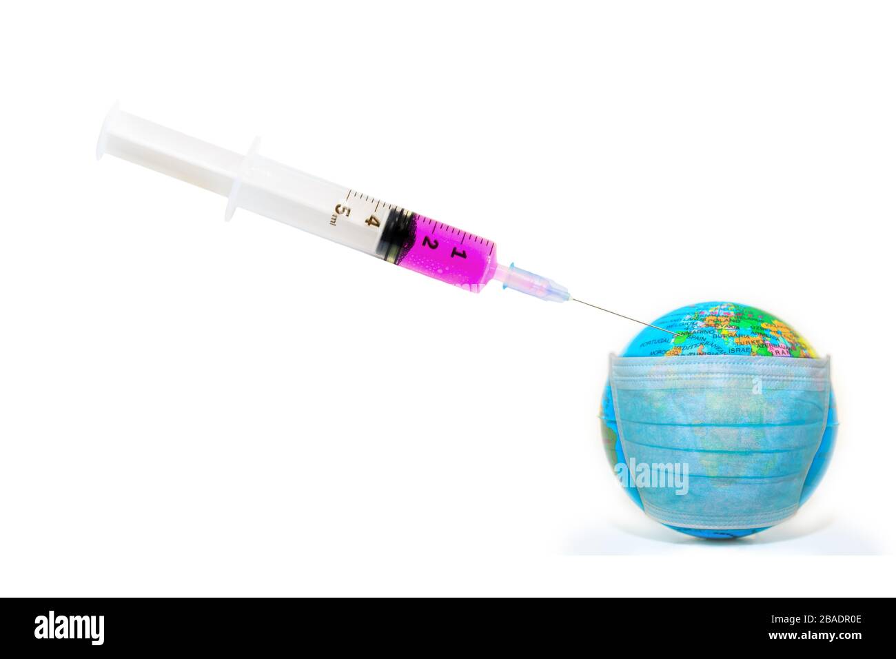 Image of a syringe with vaccine and face mask on a sick world globe isolated on white background. Epidemic flu and pandemic emergency worldwide for Stock Photo