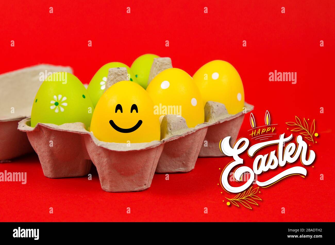 Colorful Easter eggs in a group on a red background Stock Photo