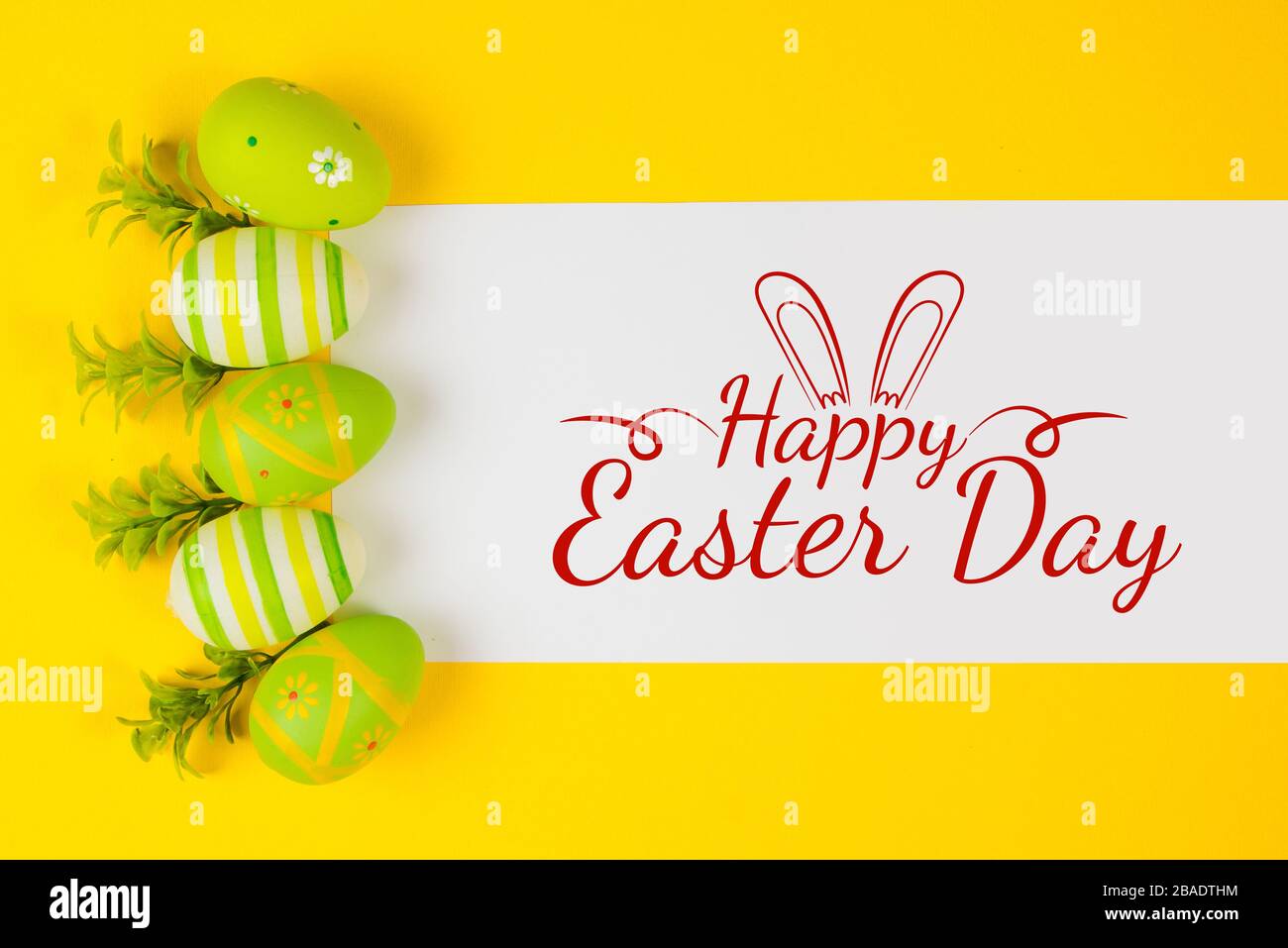 Decorted Easter eggs in a bird's nest on a yellow background Stock ...