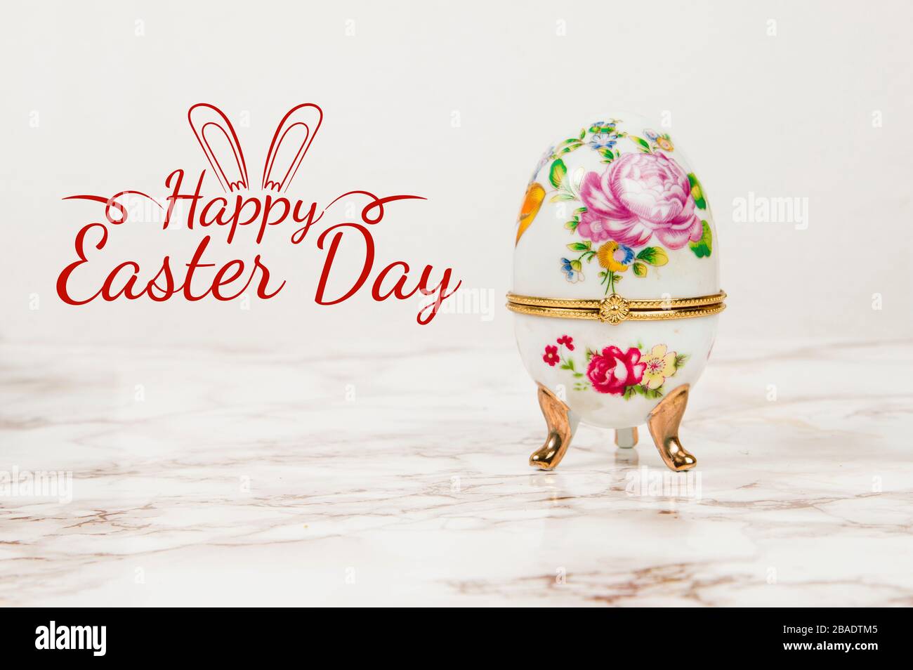Luxury Easter egg with decorations on a marble background Stock Photo