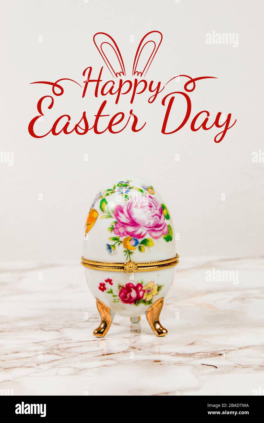 Luxury Easter egg with decorations on a marble background Stock Photo
