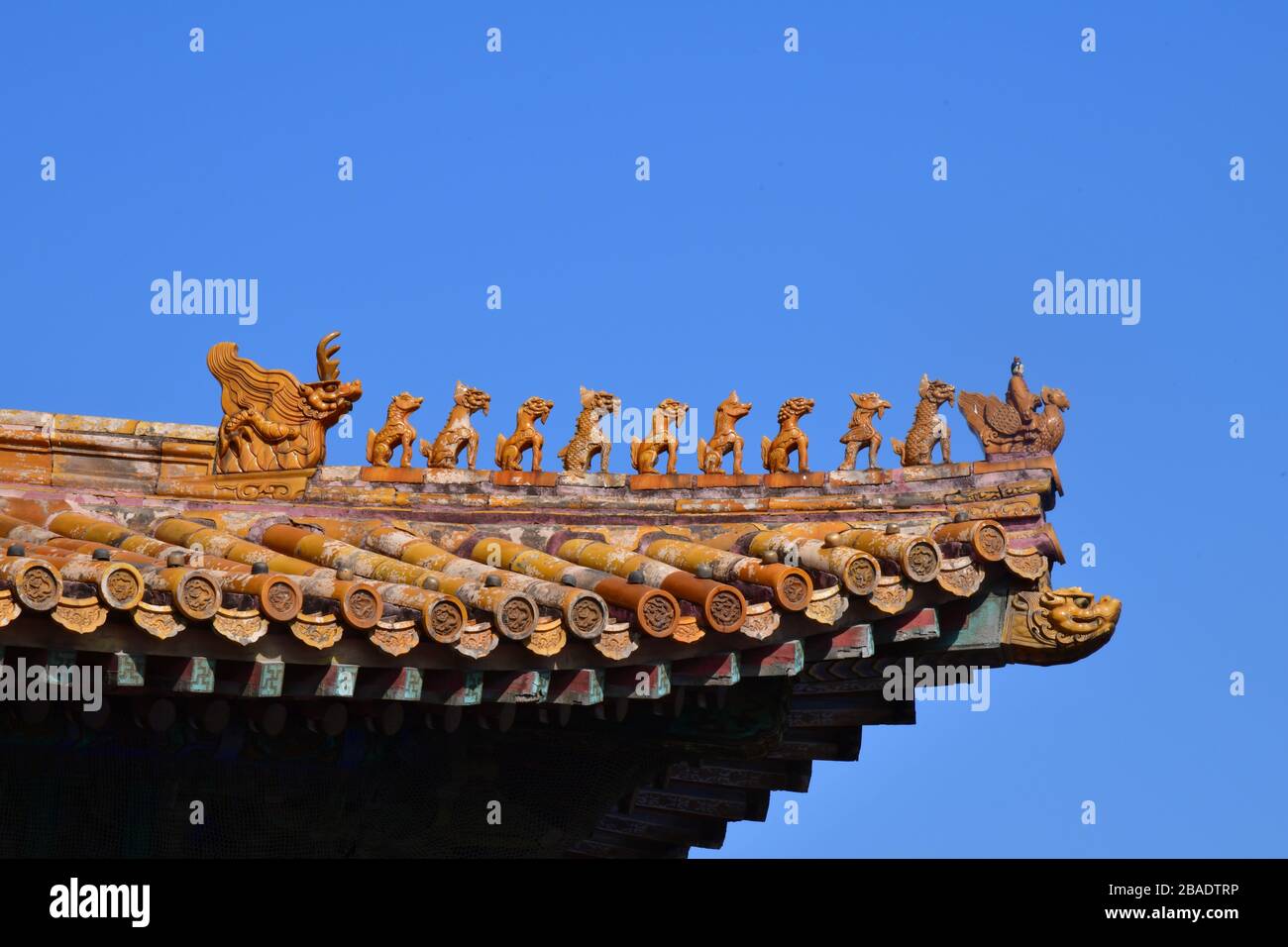 Total of eleven roof ridge statues on one of the ancient palaces of the Forbidden City in Beijing China Stock Photo