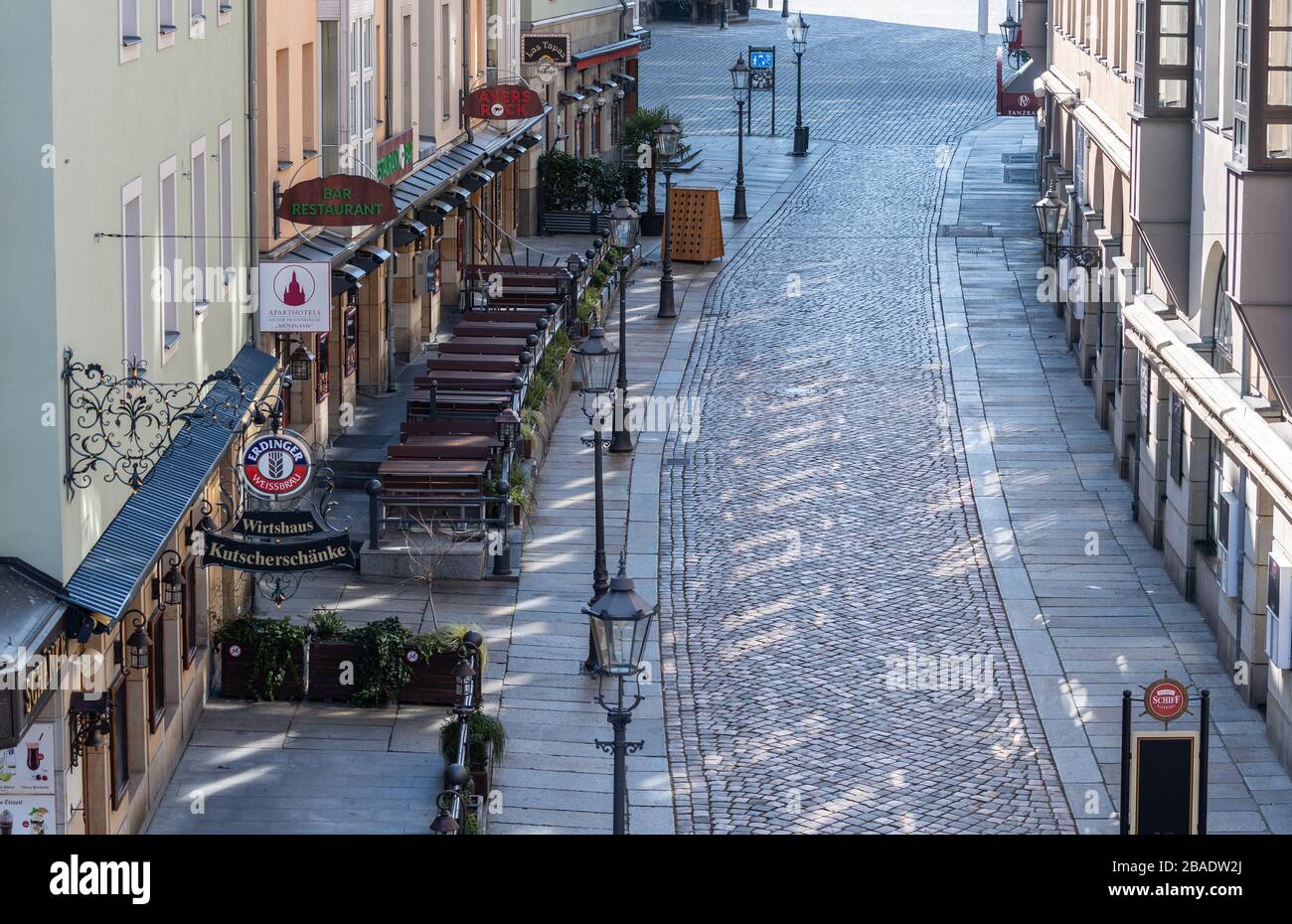 Dresden, Germany. 25th Mar, 2020. The Münzgasse to Neumarkt is deserted. To contain the coronavirus, Saxony now bans all accumulations of three or more people in public. Credit: Robert Michael/dpa-Zentralbild/dpa/Alamy Live News Stock Photo