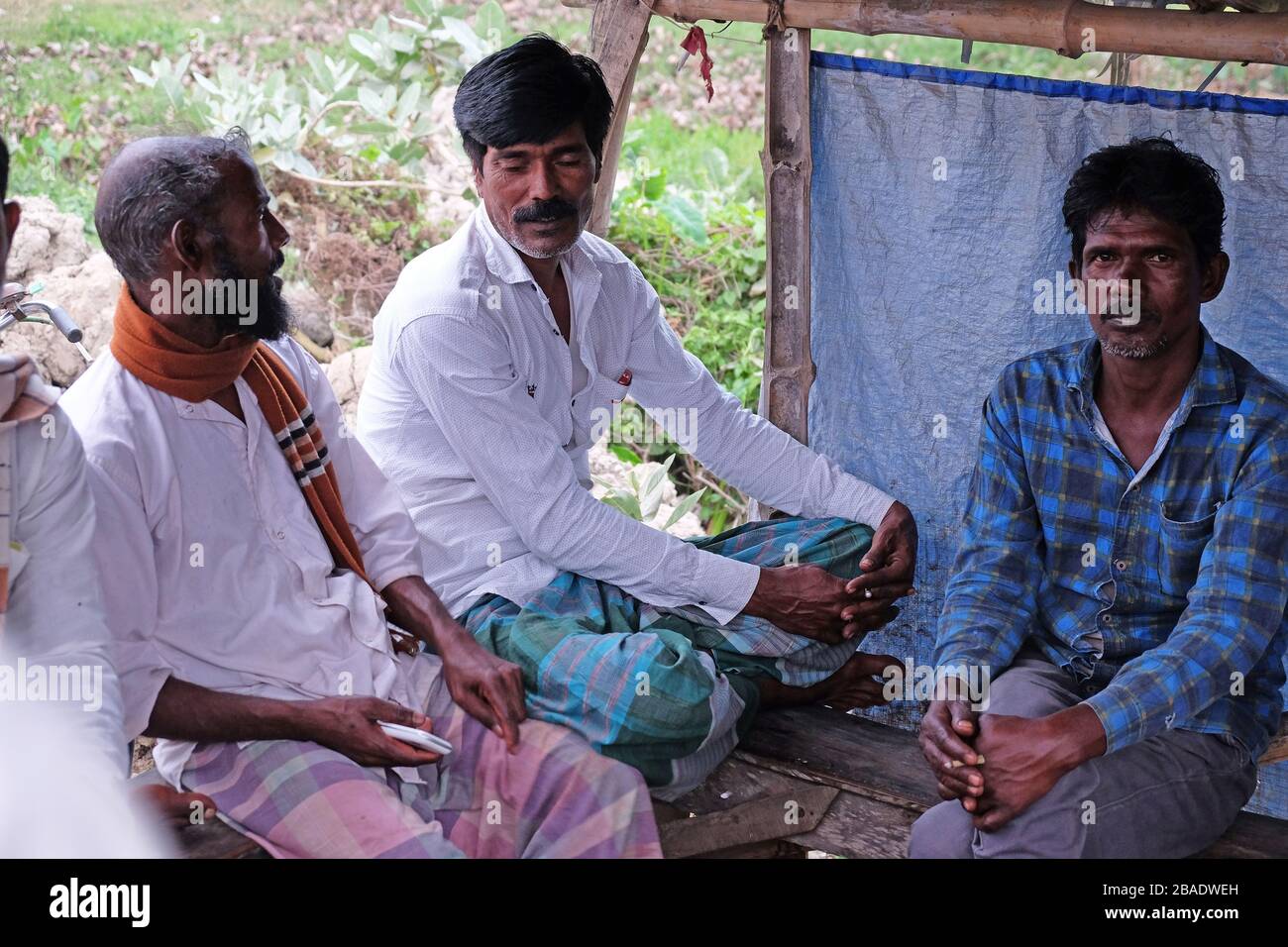 Indian men in a typical tea house in Kumrokhali village, West Bengal, India Stock Photo