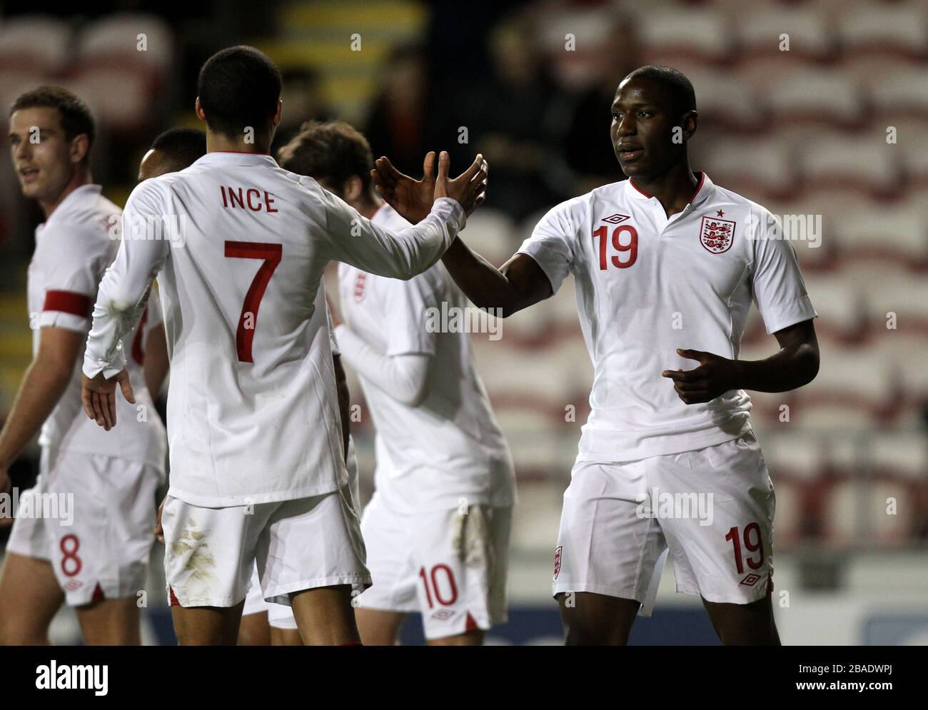 England's Benik Afobe (right) celebrates scoring with teammate Tom Ince (left) Stock Photo