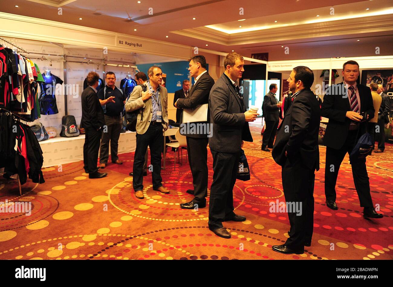 Delegates mingle around the exhibitions in the exhibition hall Stock Photo