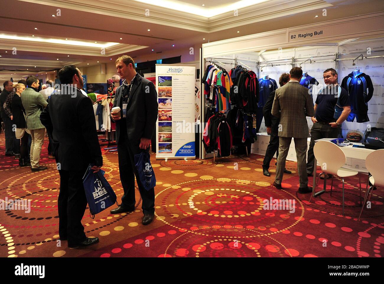 Delegates mingle around the exhibitions in the exhibition hall Stock Photo
