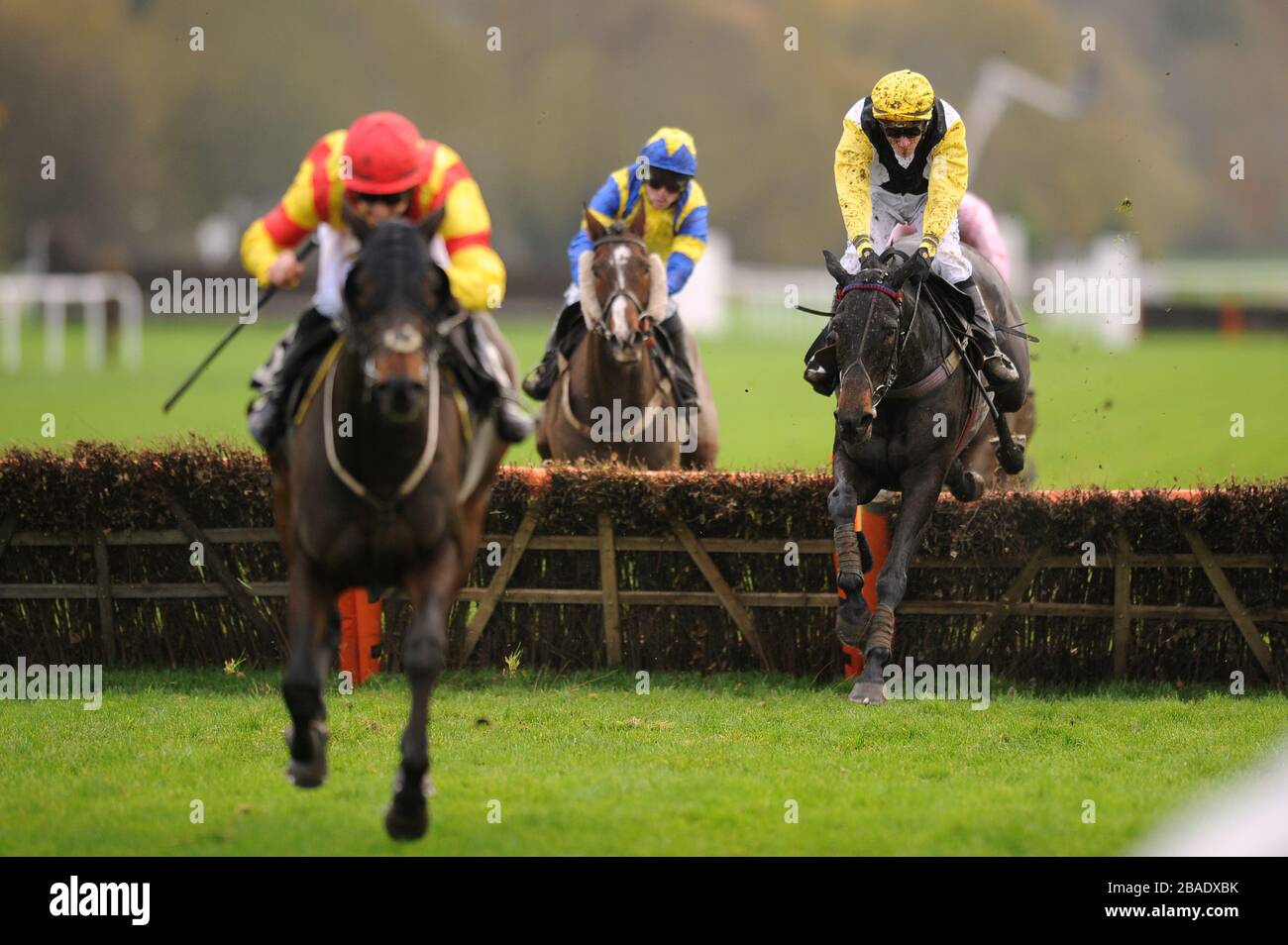 Lodgician ridden by Martin Harley (left), Rime Avec Gentile ridden by Martin Lane (right) and Rosoff ridden by Ian Mongan in action in the William Hill 'Flat Jockeys' Handicap Hurdle Stock Photo
