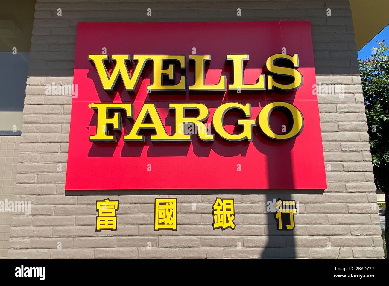 A general view of a Wells Fargo logo on a bank branch in Washington, D.C.,  on Friday, April 30, 2021, amid the coronavirus pandemic. Earlier this week  President Biden gave his first