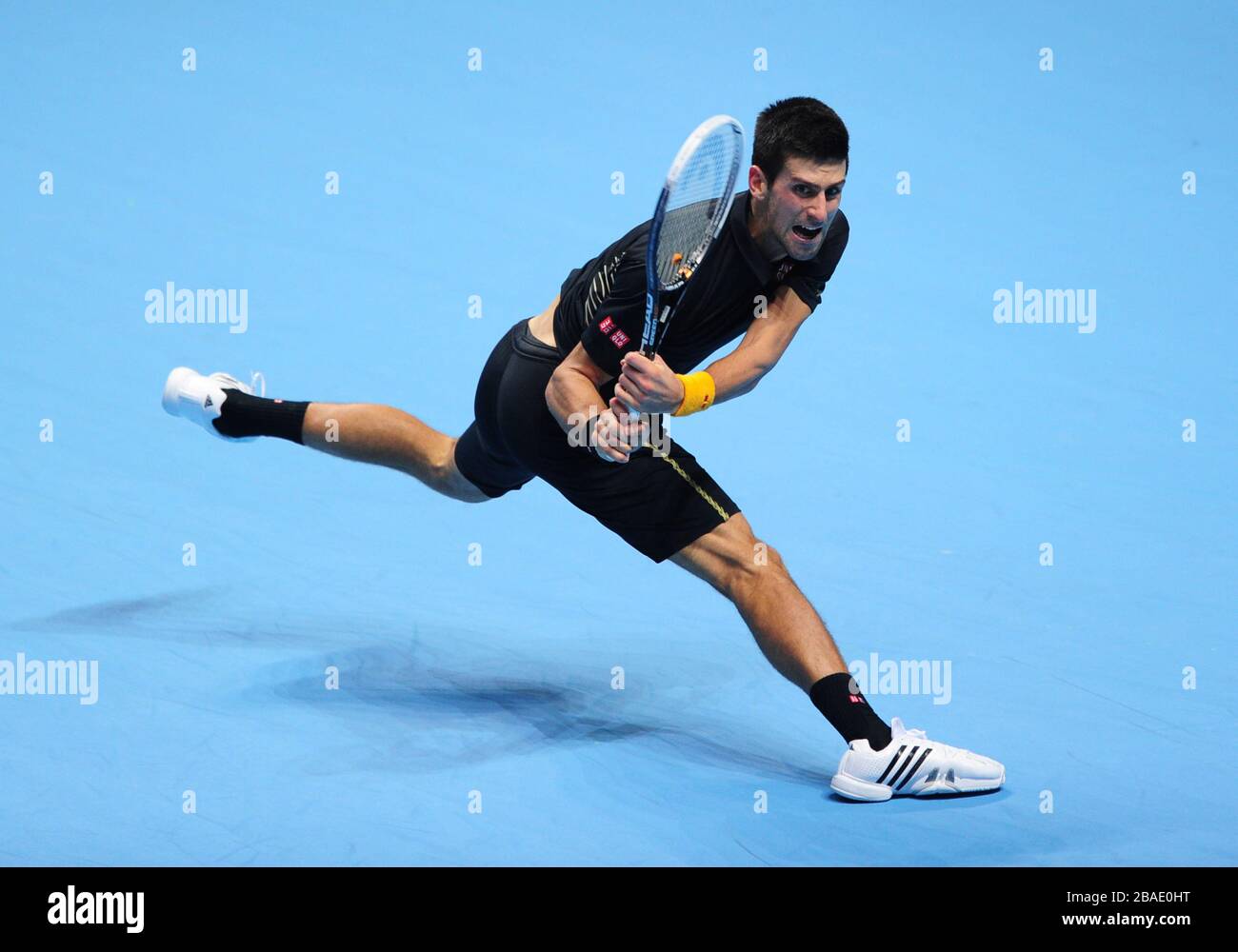 Serbia's Novak Djokovic in action against Switzerland's Roger Federer Stock Photo