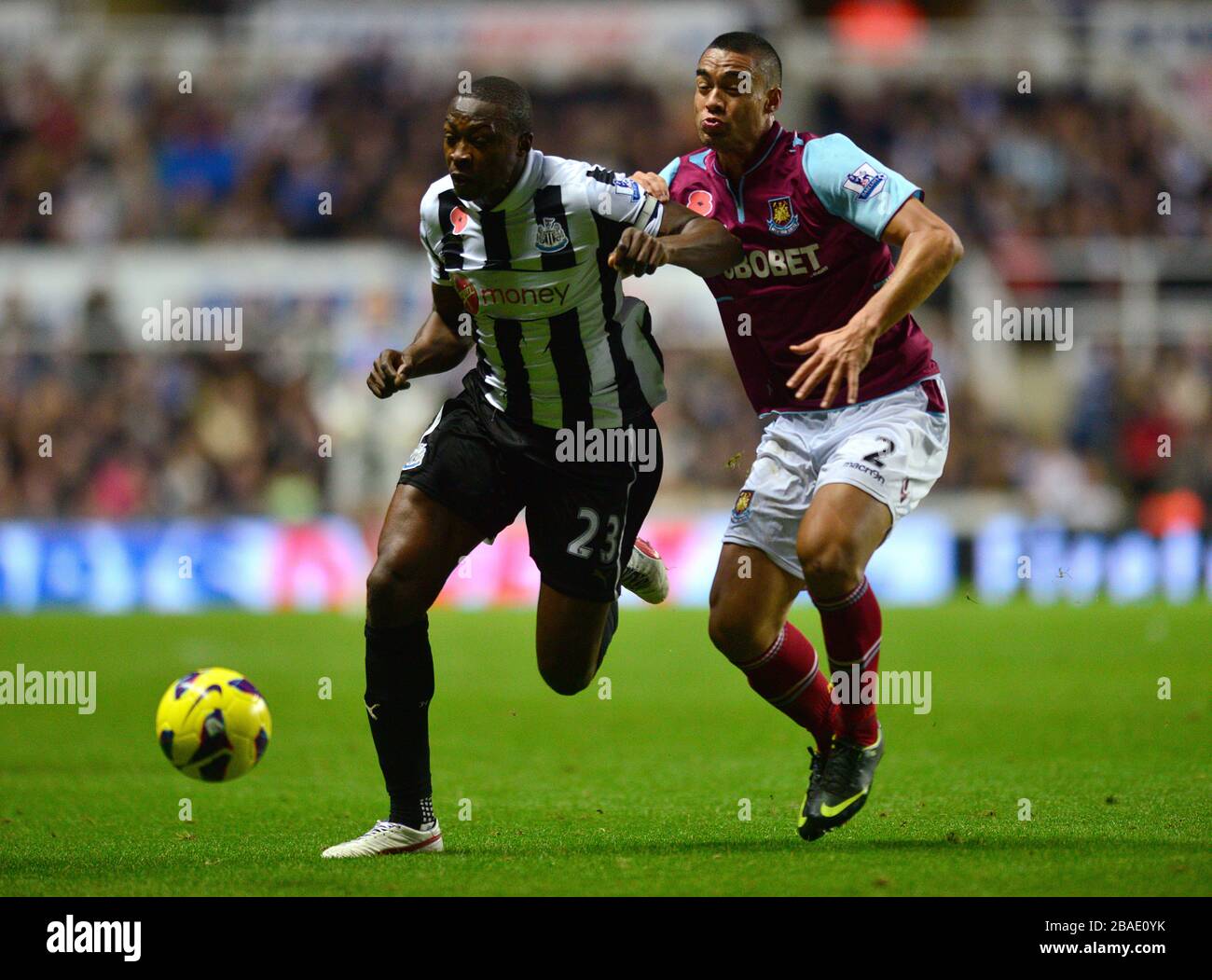 West Ham United's Winston Reid (right) and Newcastle United's Shola Ameobi (right) battle for the ball Stock Photo