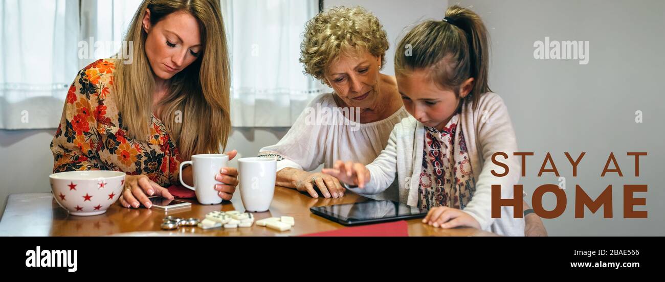 Three female generations using tablet and smartphone Stock Photo