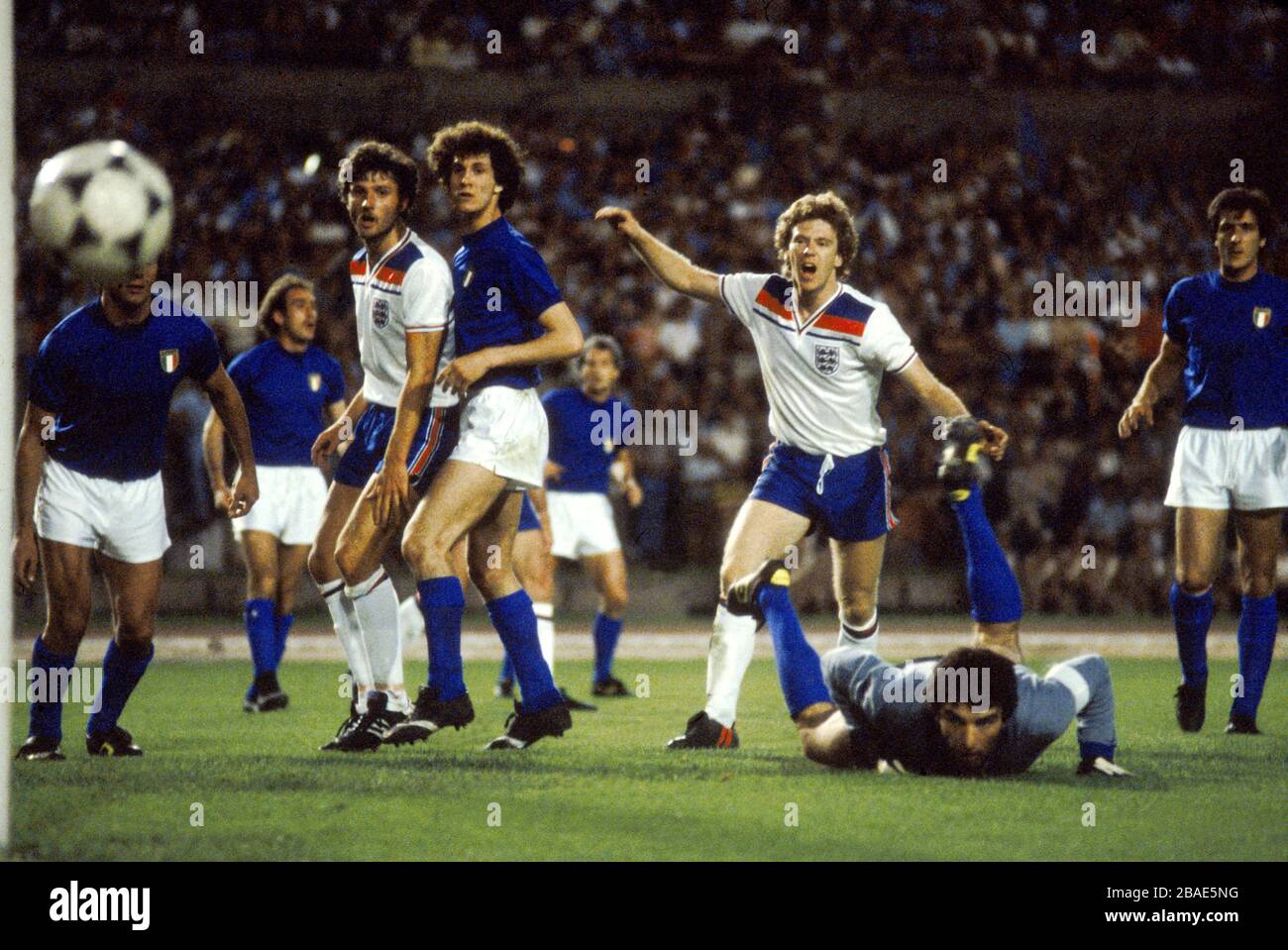 Italy Goalkeeper Dino Zoff (on Floor) makes a great save as England's Garry Birtles and Tony Woodcock look on Stock Photo