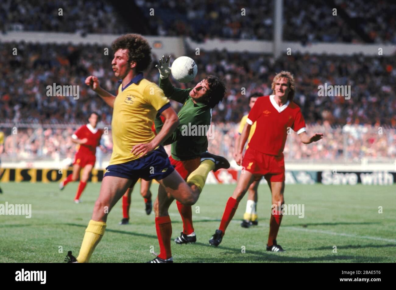 Liverpool goalkeeper Ray Clemence (centre) saves from Arsenal's Alan
