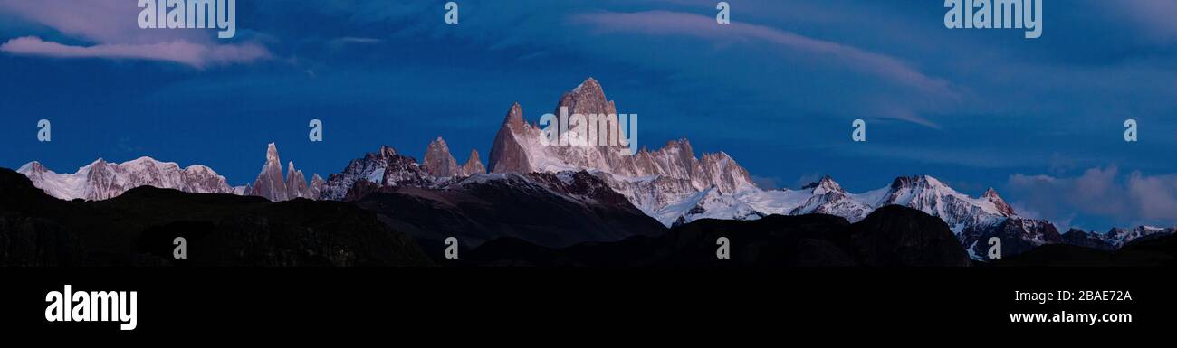 A Panoramic photo of sunrise over Mount Fitzroy in El Chalten in Southern Patagonia, Argentina Stock Photo