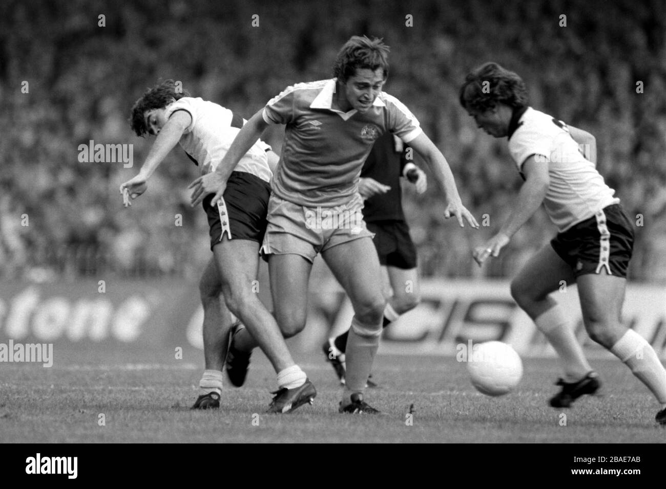 Manchester City's Michael Robinson (c) loses the ball to Crystal Palace's Kenny Sansom (r) after dispossessing Jerry Murphy (l) Stock Photo