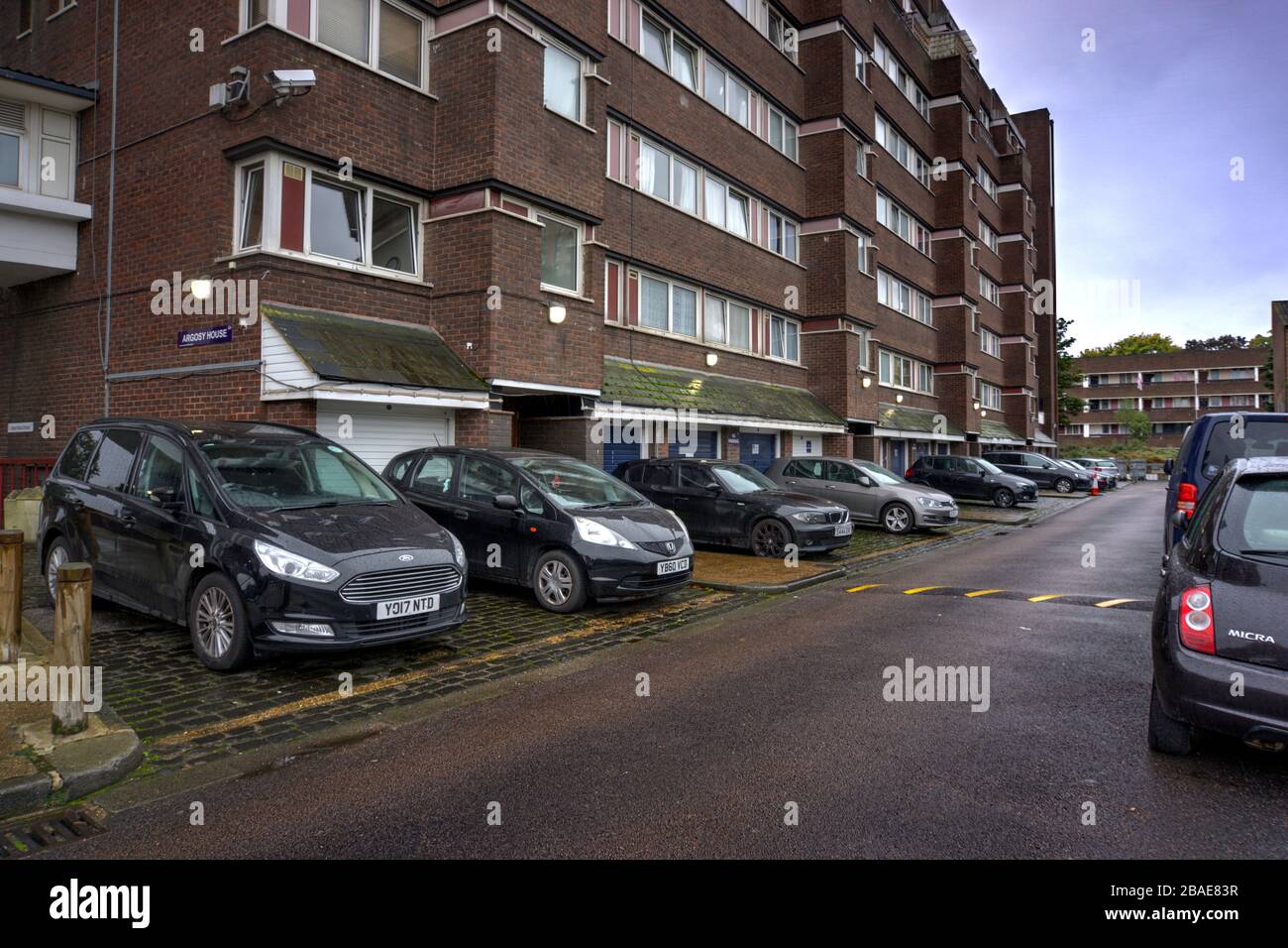 Deptford, London, United Kingdom - October 12, 2019: Argosy House part of the Pepys social housing estate from rear showing parked cars. Stock Photo