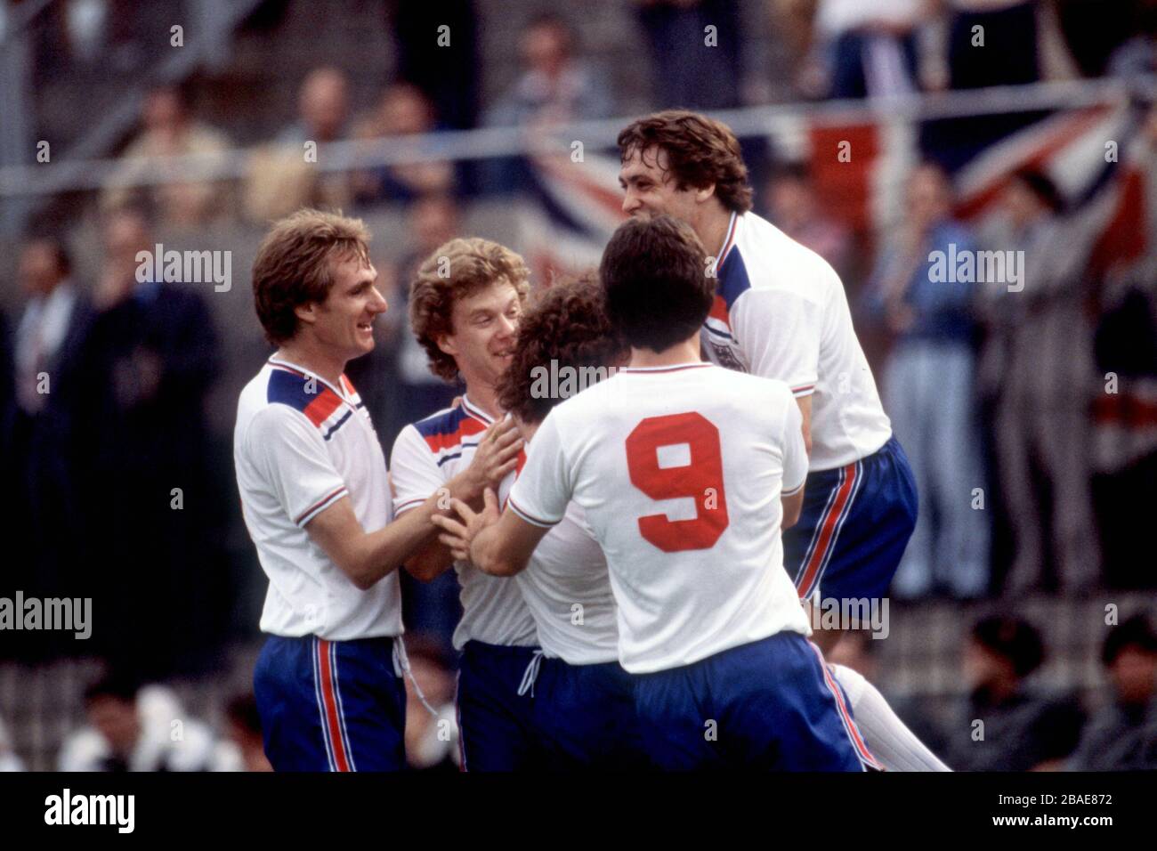 England's Ray Wilkins (hidden) is congratulated by teammates (l-r) Phil Thompson, Tony Woodcock, Kevin Keegan, David Johnson and Kenny Sansom after scoring the opening gaol Stock Photo
